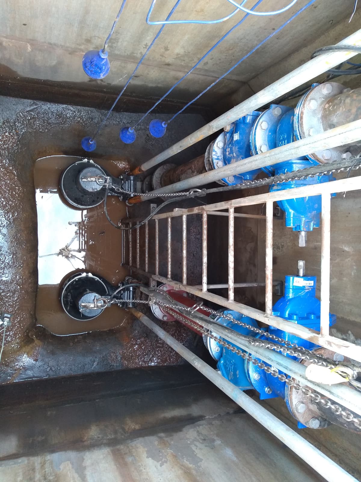 New pumps and valves installed in a pumping station wet well