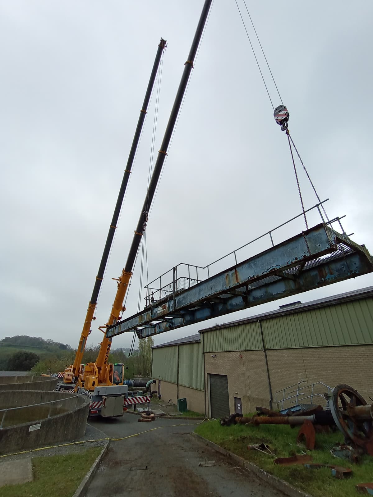 Cranes removing a redundant scraper bridge at a treatment works